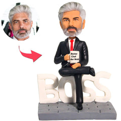 Kundenspezifischer Bobbleheads Der beste Chef-Geschäftsmann der Welt addieren Text