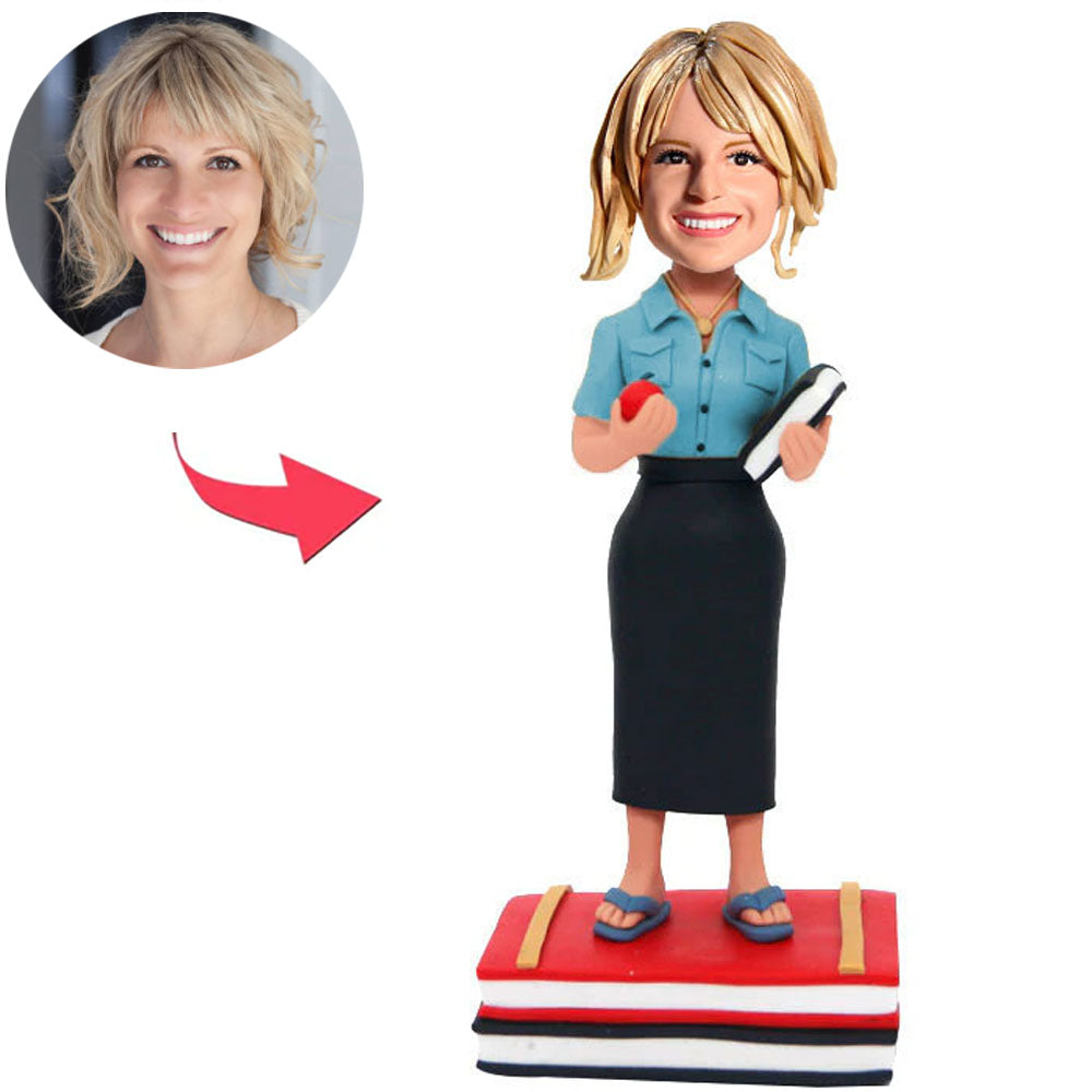 Abschlussmädchen hält Apfel und Buch Kundenspezifische Bobbleheads fügen Text hinzu