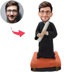 Männlicher Absolvent mit kundenspezifischen Bobbleheads der Bücher
