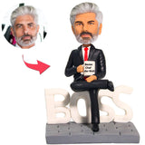 Kundenspezifischer Bobbleheads Der beste Chef-Geschäftsmann der Welt addieren Text