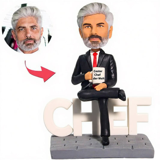 Kundenspezifischer Bobbleheads Der beste Chef-Geschäftsmann der Welt addieren Text