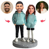 Paar trägt blaue Paar Hoodies Kundenspezifische Bobbleheads