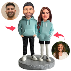 Paar trägt blaue Paar Hoodies Kundenspezifische Bobbleheads
