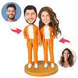 Paar trägt orange Kapuzenpullover Kundenspezifische Bobbleheads
