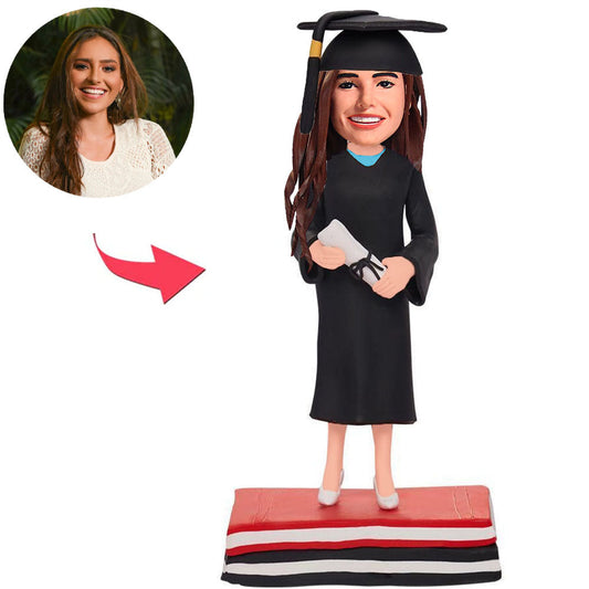 Abschlussmädchen-Buchbasis mit Abschlusshut Kundenspezifische Bobbleheads fügen Text hinzu