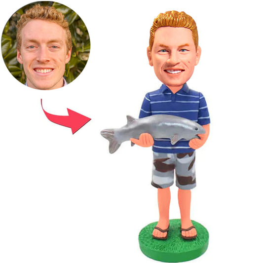Mann, der große Fisch-kundenspezifische Bobbleheads hält, addieren Text