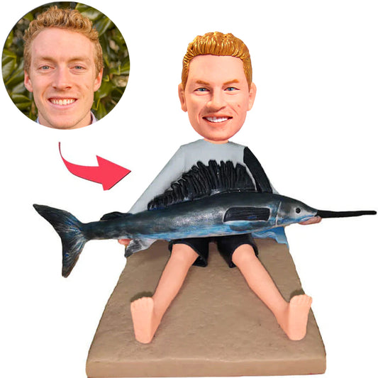 Mann, der Thunfisch-kundenspezifische Bobbleheads hält, addieren Text