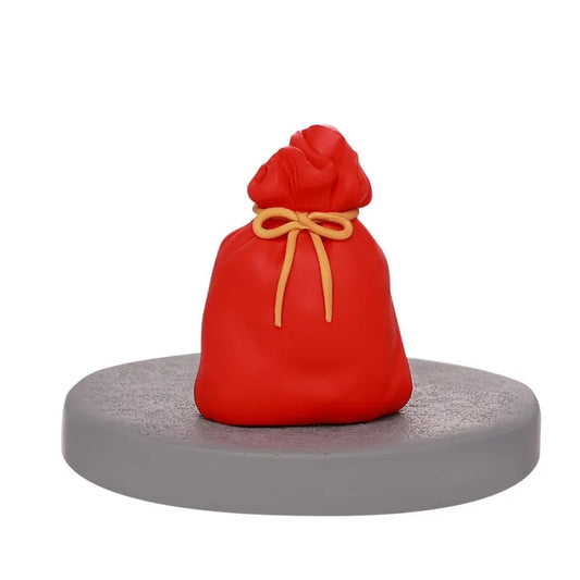 Figurensockel mit rotem Geschenksack