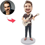 Mann, der Gitarren-kundenspezifische Bobbleheads spielt, addieren Text