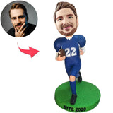 Der in blau bekleidete footballspieler Kundenspezifische Bobbleheads mit eingraviertem Text